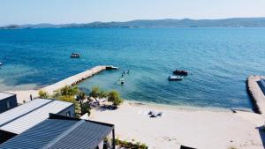 a view of a beach with boats in the water at Mobile Home Sea Breeze in Sveti Petar