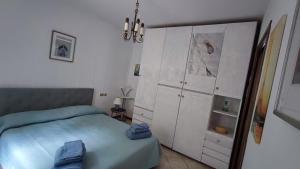 Postel nebo postele na pokoji v ubytování Blu dipinto di blu - Como Lake View - Perledo