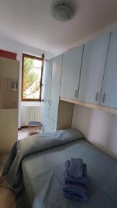 Postel nebo postele na pokoji v ubytování Blu dipinto di blu - Como Lake View - Perledo