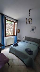 Postel nebo postele na pokoji v ubytování Blu dipinto di blu - Como Lake View - Perledo
