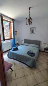 Postel nebo postele na pokoji v ubytování Blu dipinto di blu - Como Lake View - Perledo