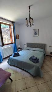 Postel nebo postele na pokoji v ubytování Blu dipinto di blu - Como Lake View - Perledo
