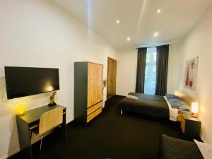 Posteľ alebo postele v izbe v ubytovaní Topolove Rooms & Apartments