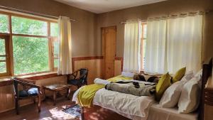 Postel nebo postele na pokoji v ubytování Hotel Gangchen Tabo