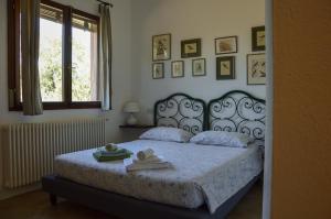 Postel nebo postele na pokoji v ubytování Agriturismo Picchio Rosso