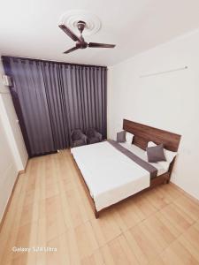 Postel nebo postele na pokoji v ubytování Mohali Hotel
