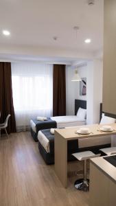 Postel nebo postele na pokoji v ubytování Hide Apart Hotel