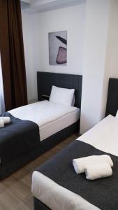 Postel nebo postele na pokoji v ubytování Hide Apart Hotel