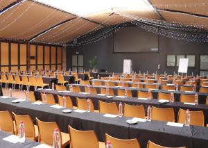 an empty hall with tables and chairs in it at Olifants River Lodge by Dream Resorts in Middelburg +78 photos
