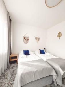 Łóżko lub łóżka w pokoju w obiekcie Hotel Beskidian