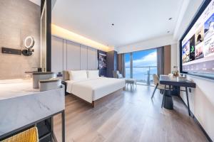 Voodi või voodid majutusasutuse Atour Hotel Zhengzhou North Dragon Lake Financial Center toas