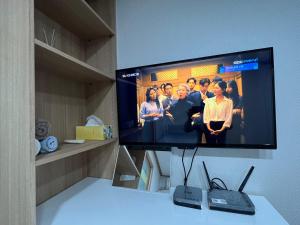 TV a/nebo společenská místnost v ubytování Sangmin Sweet