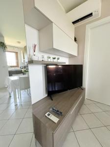 a living room with a large flat screen tv at Torakiki's Home Linate Airport M2 Lambrate in Milan