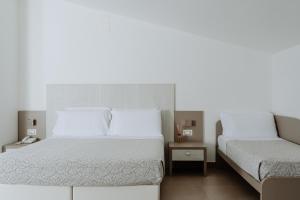Letto o letti in una camera di Hotel Caravel