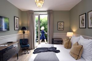 Postel nebo postele na pokoji v ubytování Grand Hôtel Henri - Teritoria