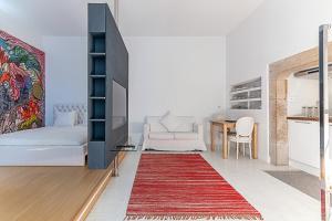 Ένα ή περισσότερα κρεβάτια σε δωμάτιο στο Portas do Castelo Apartments