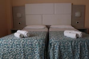 Postel nebo postele na pokoji v ubytování Hotel Costa Verde