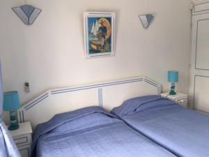 Een bed of bedden in een kamer bij Studio Manguillier