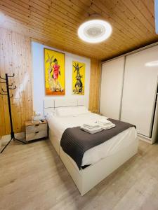 En eller flere senge i et værelse på Puerto Nova Atico