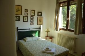 Postel nebo postele na pokoji v ubytování Agriturismo Picchio Rosso + 34 fotografií