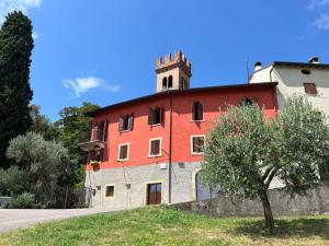 a building with a tower on top of it at Corte Cavolo in Grezzana