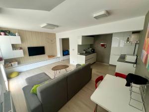 a living room with a couch and a table at Luxury apartman Bojnice in Bojnice