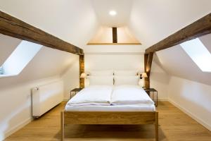 Postel nebo postele na pokoji v ubytování EMICH´S Hotel + 37 fotografií