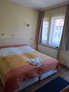 Postel nebo postele na pokoji v ubytování Guest house Skabrin