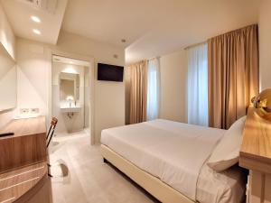 Postel nebo postele na pokoji v ubytování Hotel Lauri + 37 fotografií