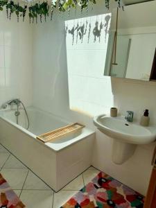 a bathroom with a tub and a sink and a toilet at Residenz zu Caub - Blücher-Suite in Kaub +13 photos