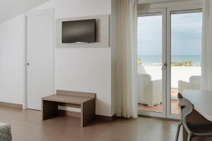 TV o dispositivi per l'intrattenimento presso Hotel Caravel