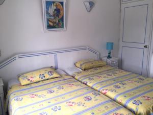 Een bed of bedden in een kamer bij Studio Manguillier
