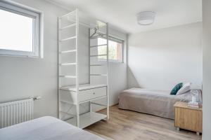 Postel nebo postele na pokoji v ubytování Bella Jūrmala ApartHotel