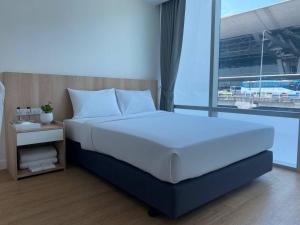 Postel nebo postele na pokoji v ubytování Prime Sleep by Miracle - Booked on Hourly Basis