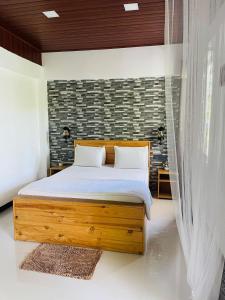 Postel nebo postele na pokoji v ubytování Dhanudi Homestay