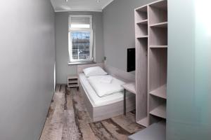 Postel nebo postele na pokoji v ubytování Do Step Inn Meidling - Self-Service-Hotel