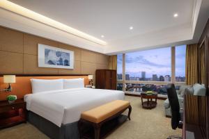 Cama ou camas em um quarto em Shangri-La Chengdu