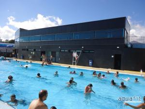 a group of people swimming in a swimming pool at Inside The Sea in Lagoa