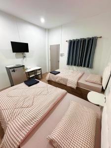 Voodi või voodid majutusasutuse Seamthong Resort เสียมทองรีสอร์ท toas +105 fotot