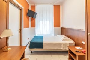 Posteľ alebo postele v izbe v ubytovaní Hotel Italia