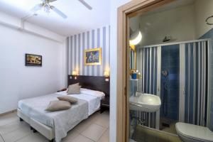 Postel nebo postele na pokoji v ubytování Hotel Ancore