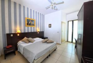 Postel nebo postele na pokoji v ubytování Hotel Ancore