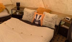 Ένα ή περισσότερα κρεβάτια σε δωμάτιο στο Badgers Burrow