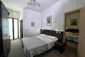 Postel nebo postele na pokoji v ubytování Hotel Ancore