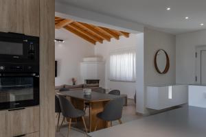 a kitchen and living room with a table and chairs at Villa Marijan in Valtura
