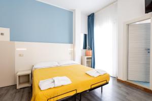 Posteľ alebo postele v izbe v ubytovaní Hotel Kim