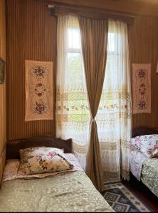 Postel nebo postele na pokoji v ubytování Martvili Guest House OASIS