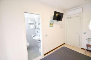 TV a/nebo společenská místnost v ubytování Hotel Grifone + 31 fotografií