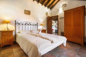 Giường trong phòng chung tại Casa Rural Cha Carmen