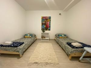 En eller flere senge i et værelse på D&M APARTMENTS